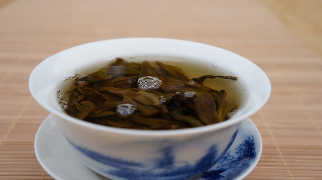 porcelain gaiwan with tea leaves